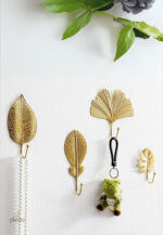 Patère murale en forme de feuille dorée, pratique et décorative